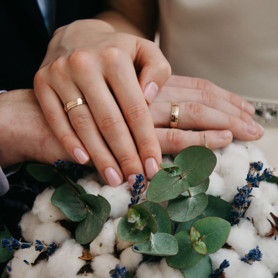 image of bride and groom holding hands